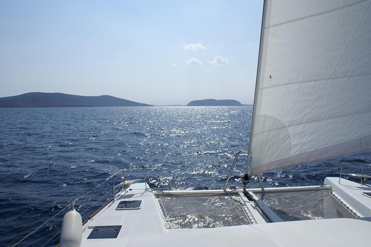 a boat with a sail in the water