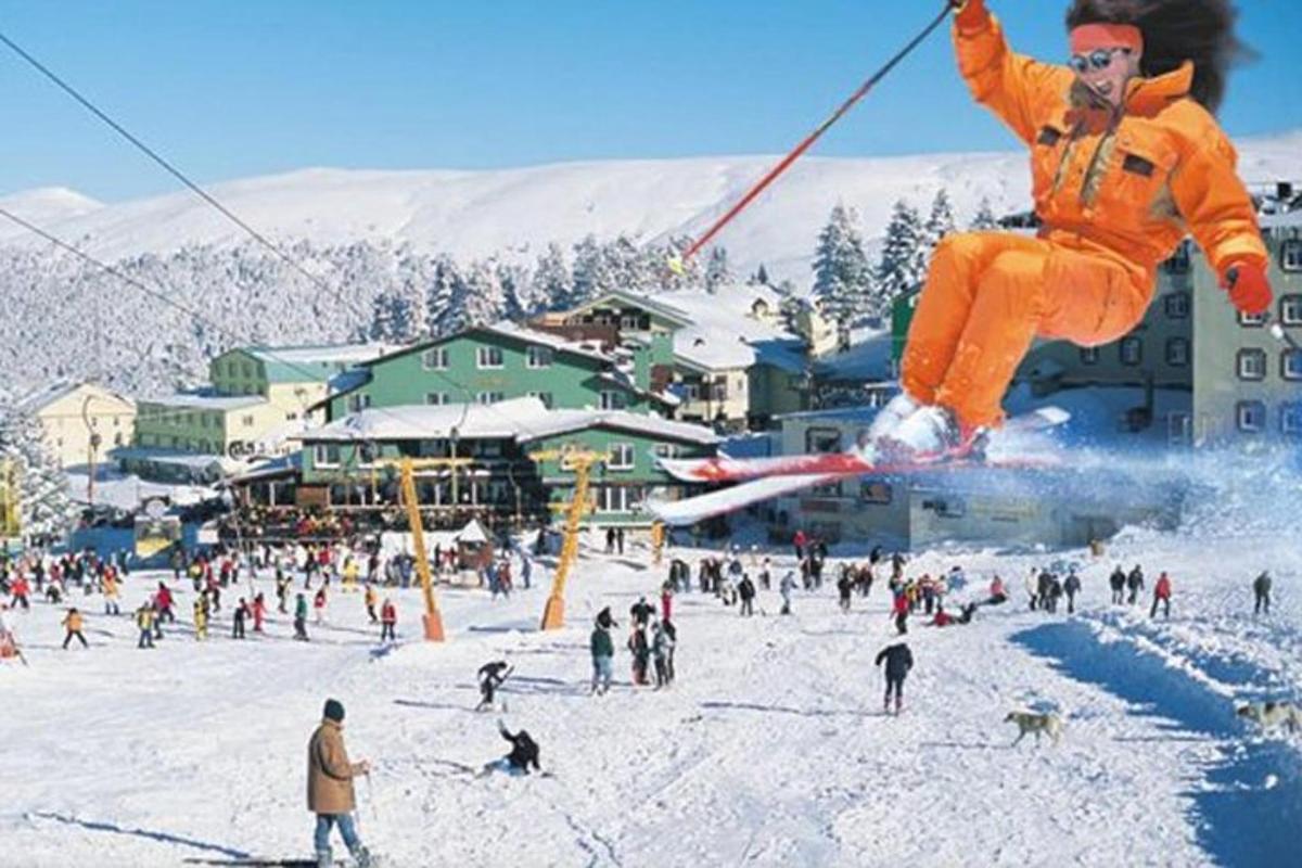 a man flying through the air on skis in the snow