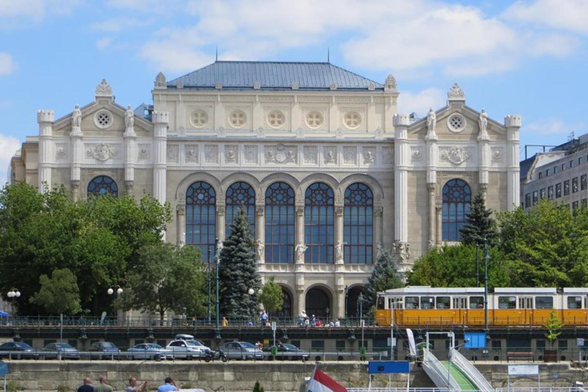 a large building with a yellow train in front of it