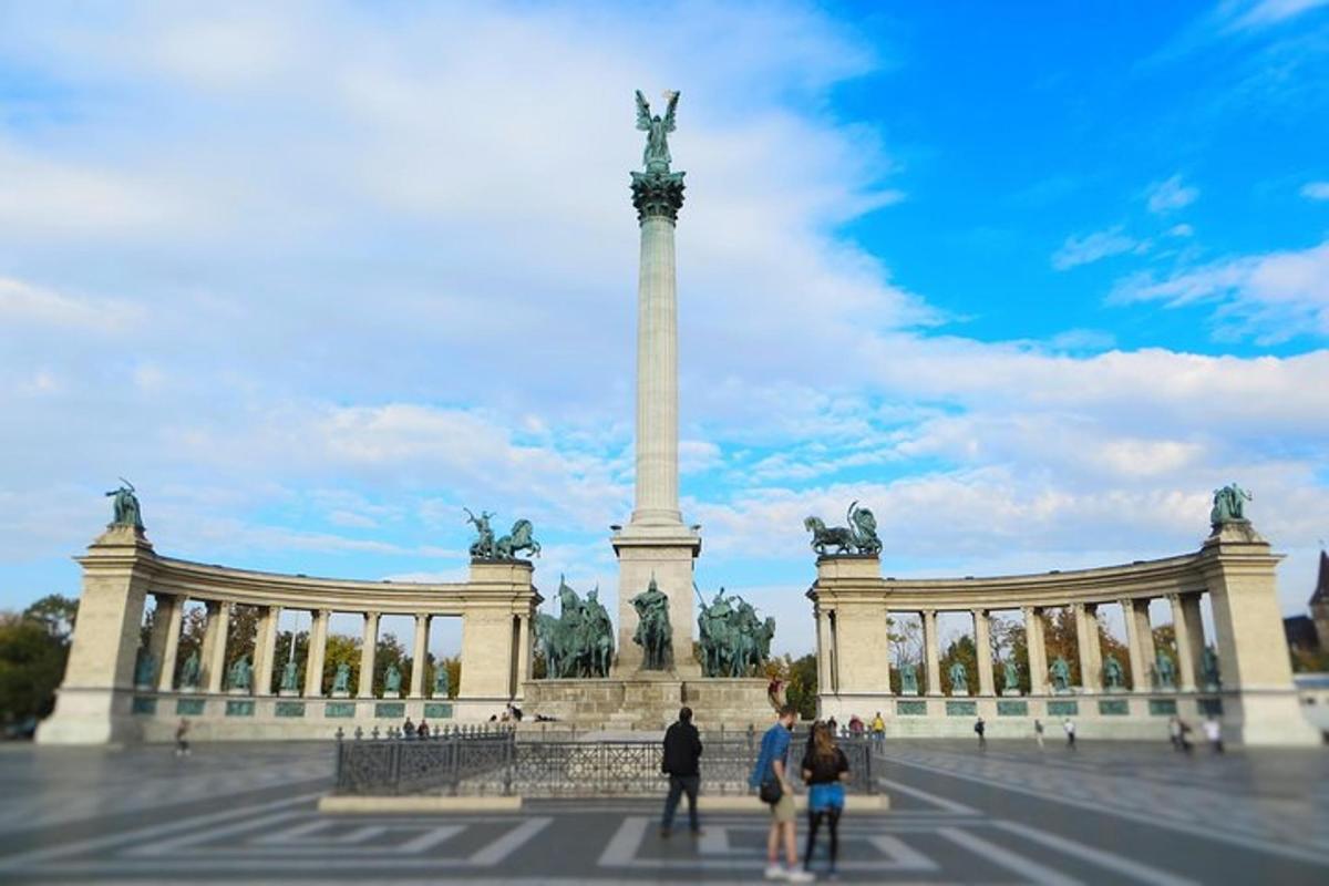 a monument with people standing in front of it