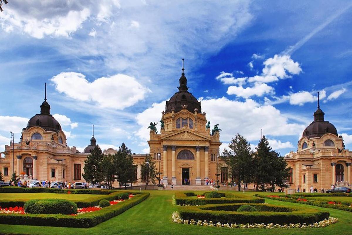 a large building with a garden in front of it