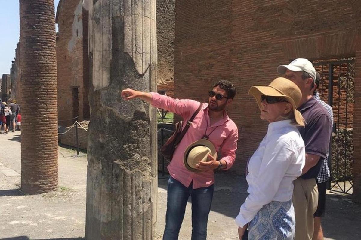 a man and a woman pointing at a tree