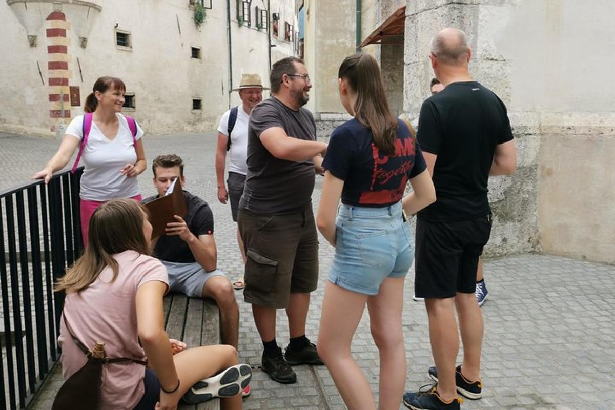 a group of people standing around on a street