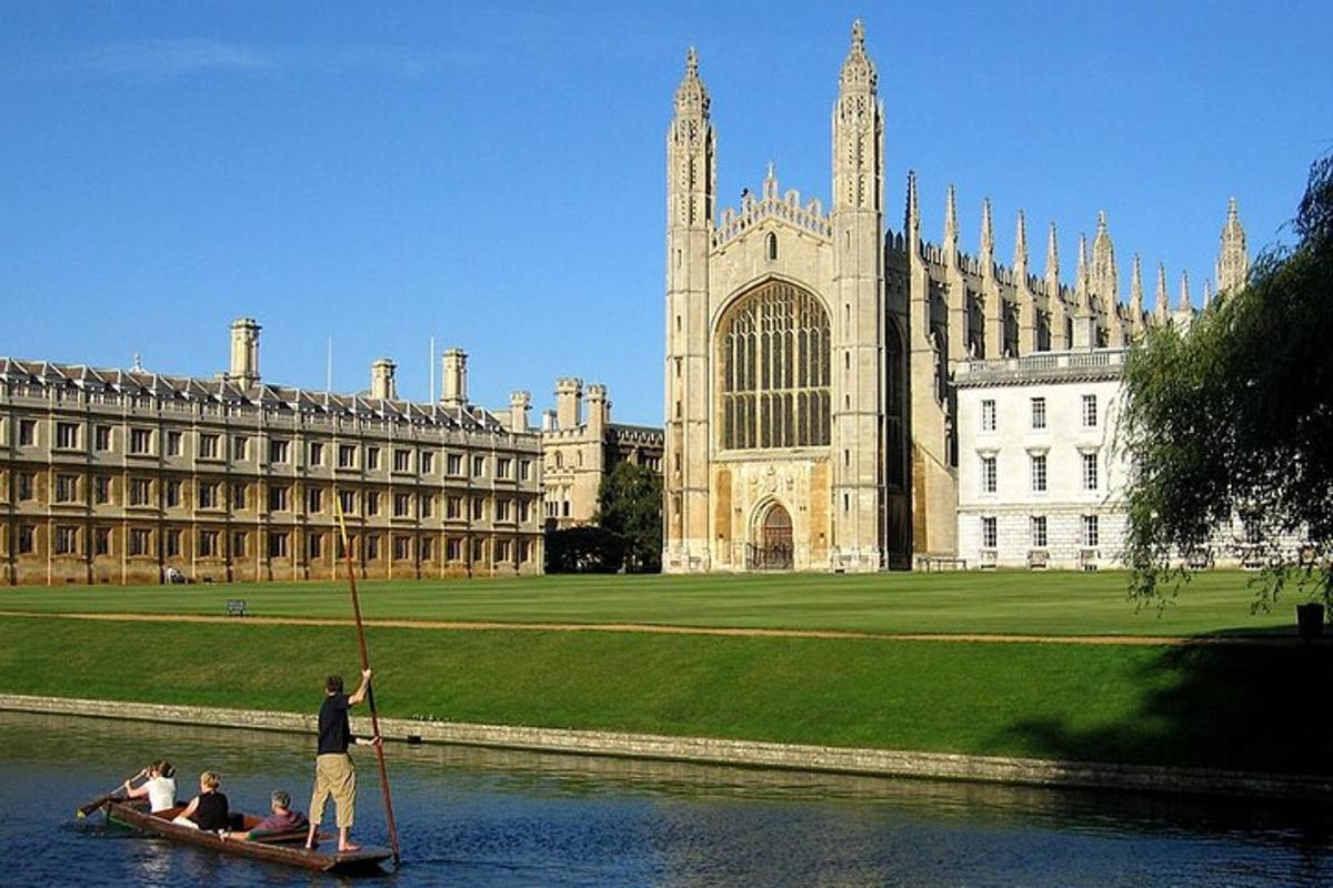 a man in a boat in the water in front of a building