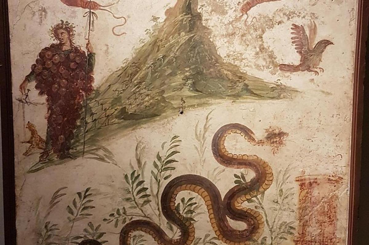 Un cuadro de un hombre y una serpiente en una pared.