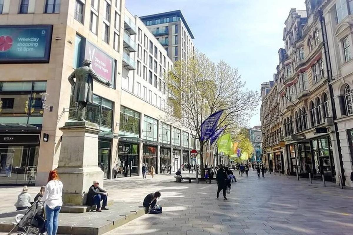 a city street with a statue in the middle