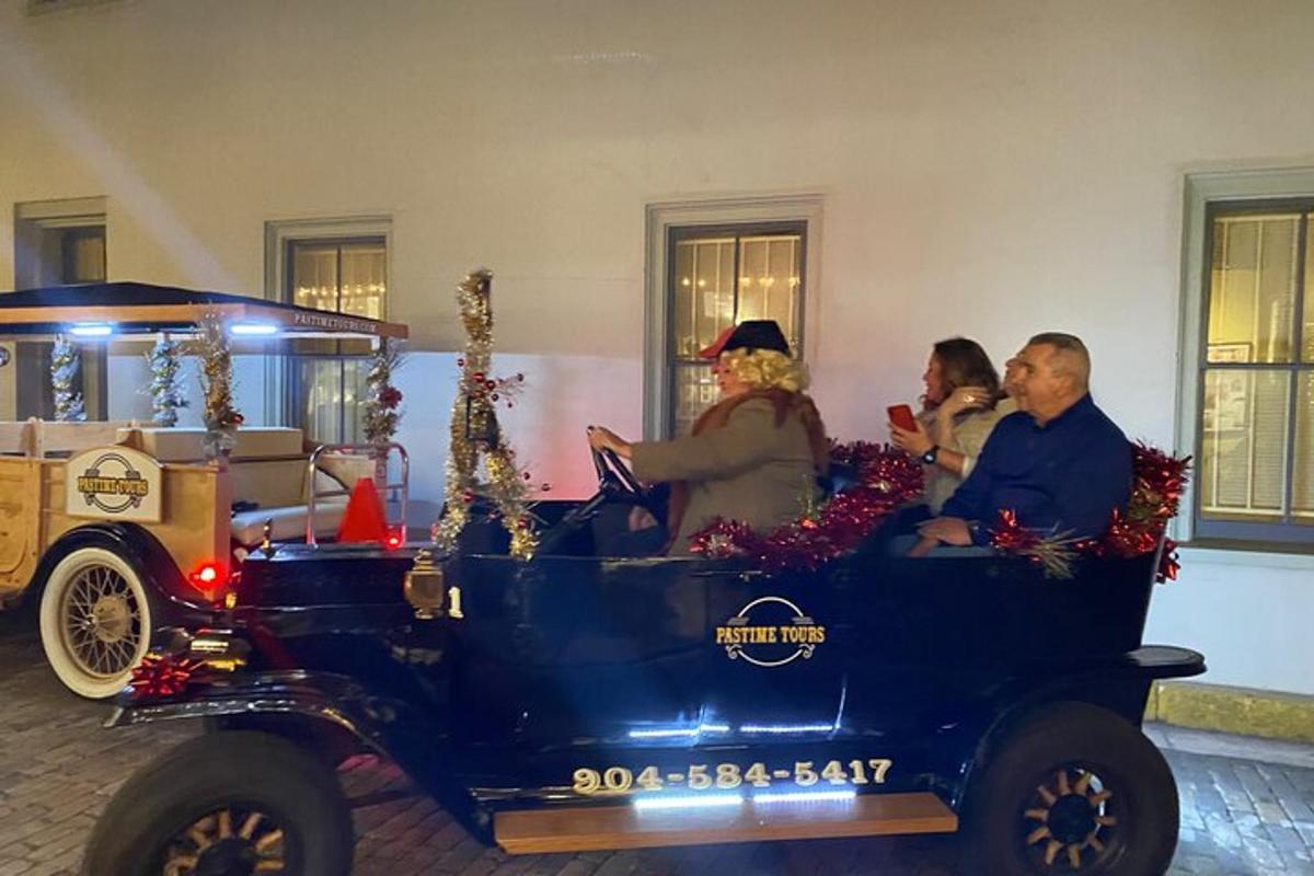 a group of people riding in an old car