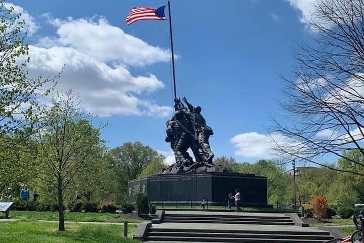 a statue with an american flag on top of it