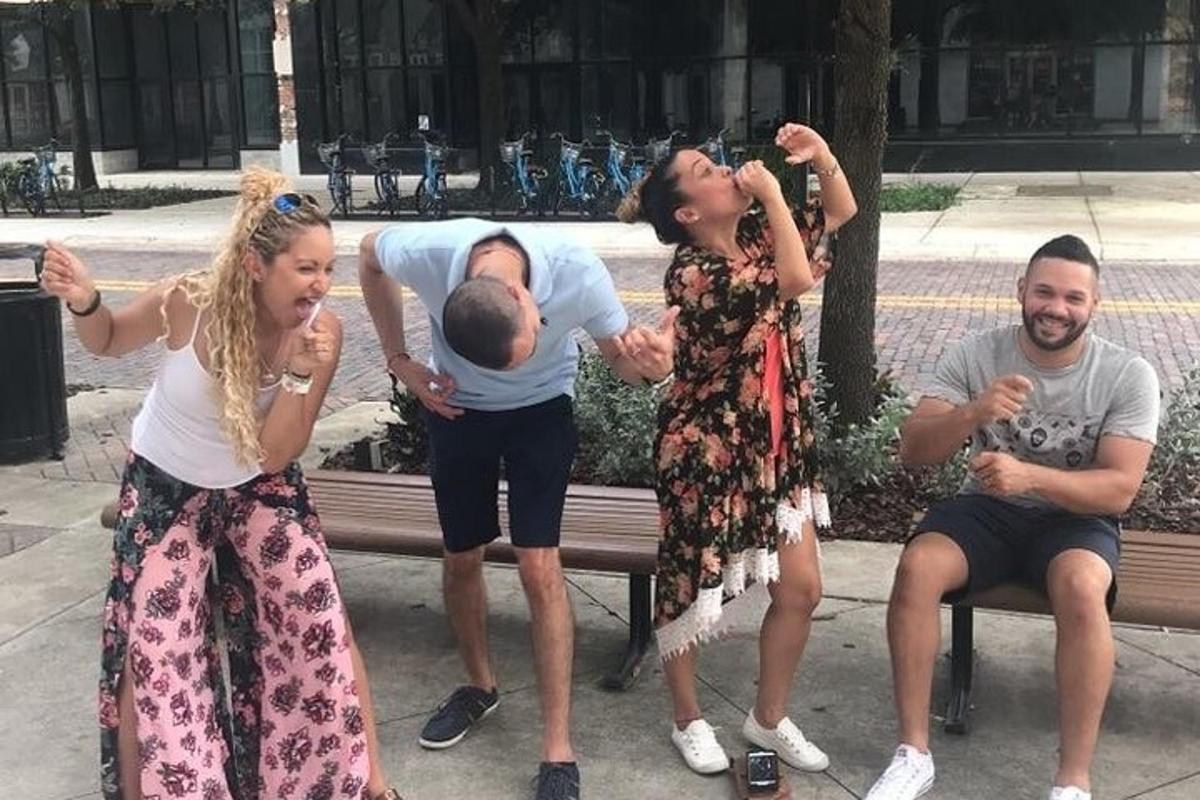 a group of people sitting on a bench with a baby