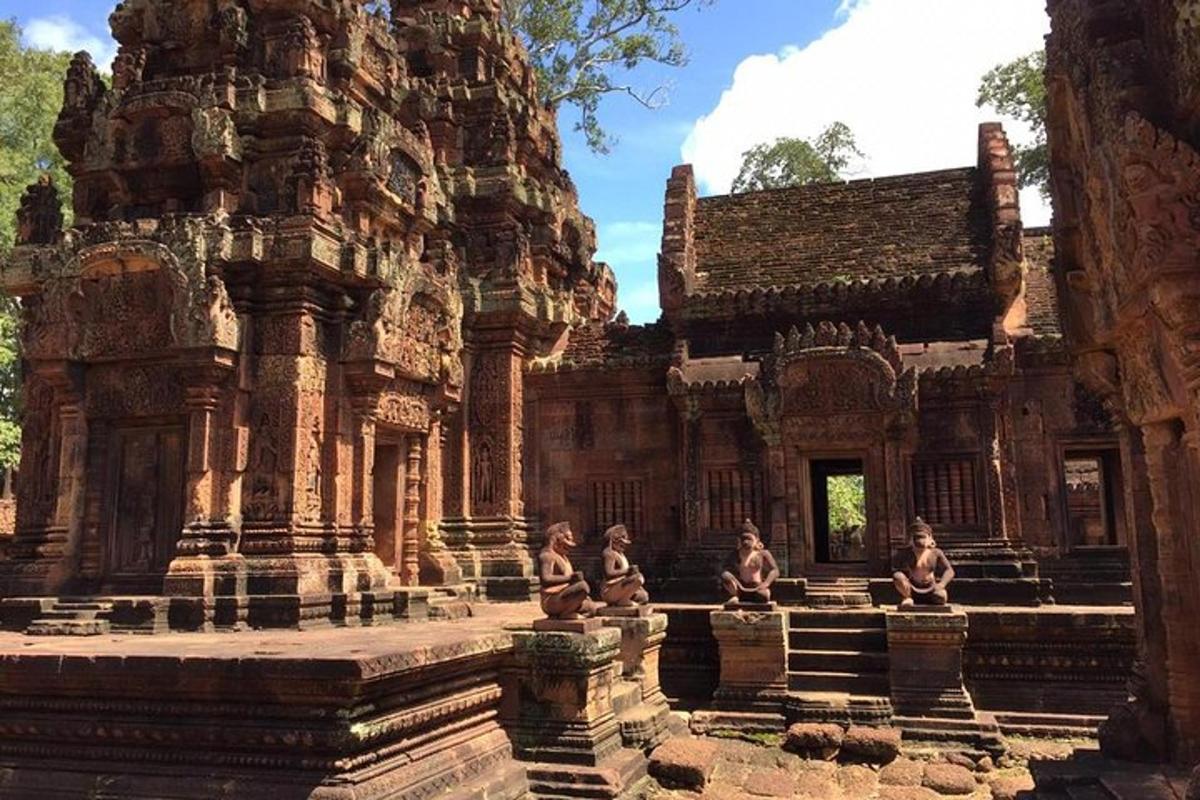 an ancient building with statues in front of it