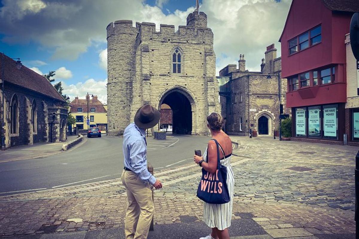 a man and a woman standing in front of a building