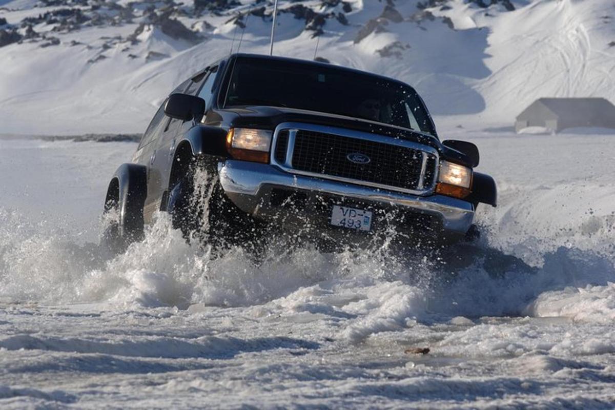 a truck driving through the snow