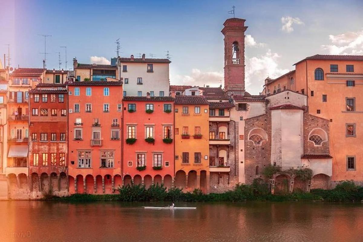 a group of buildings next to a body of water