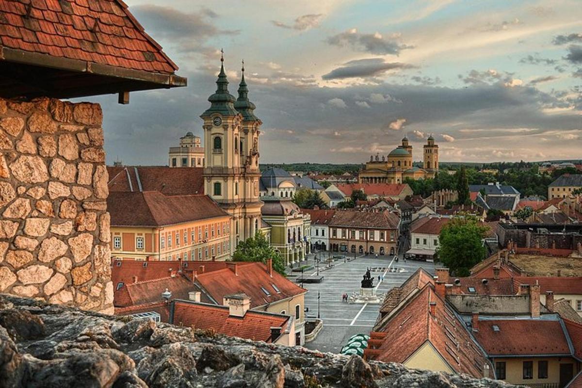 a view of a city with buildings and roofs