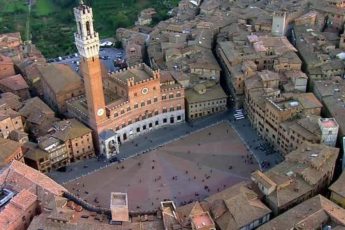 an aerial view of a city with a clock tower