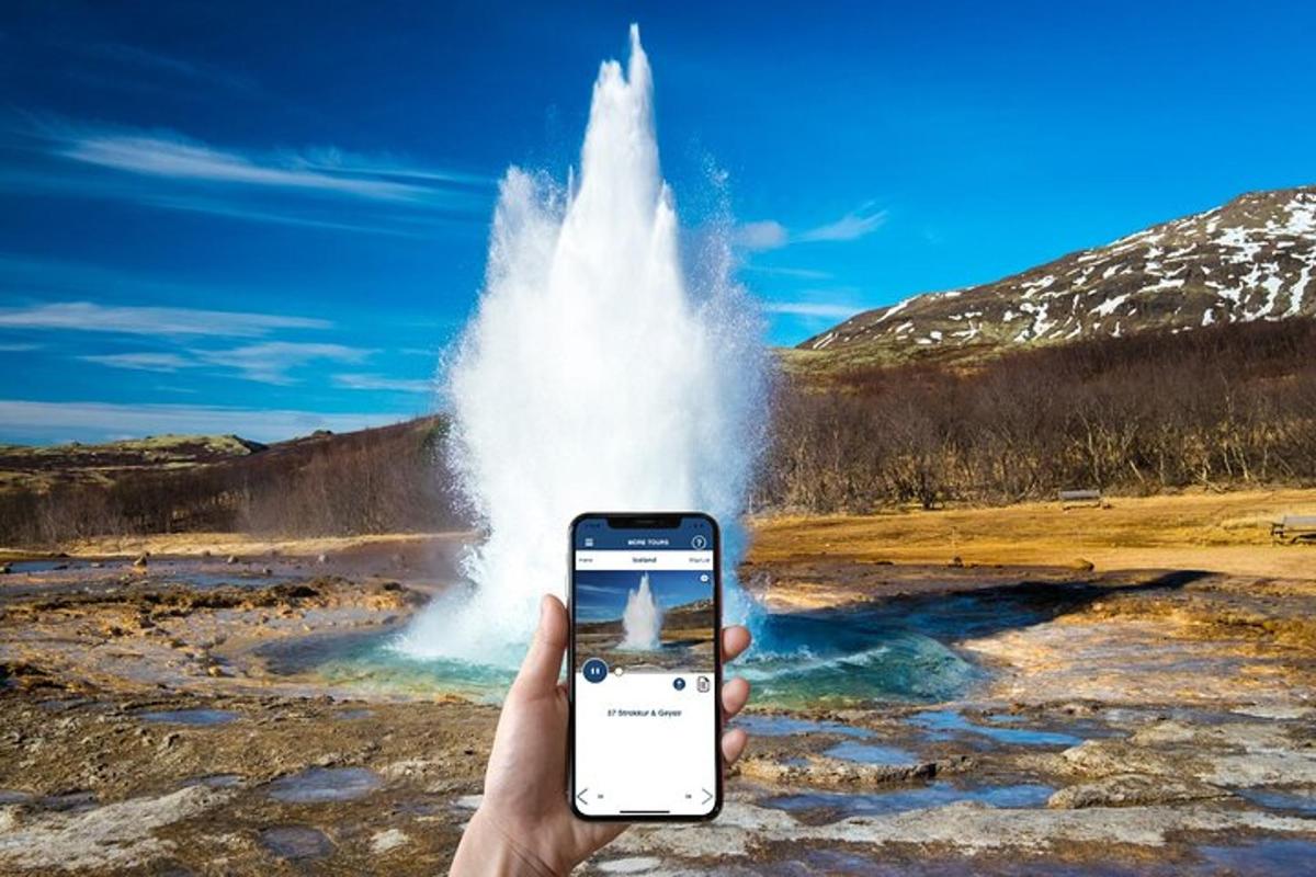 inimene, kes hoiab geisri ees mobiiltelefoni