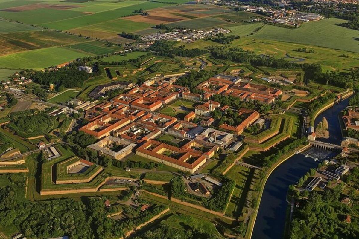 an aerial view of a city with a river