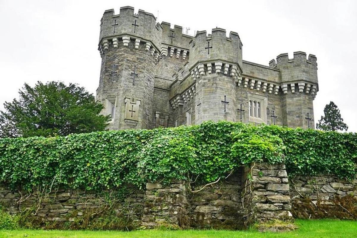 an old castle with ivy on a stone wall
