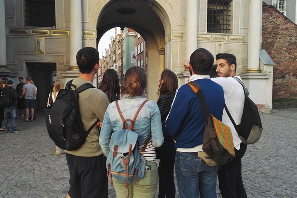 a group of people standing outside of a building