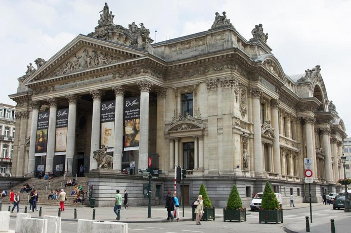 a large building with people walking in front of it