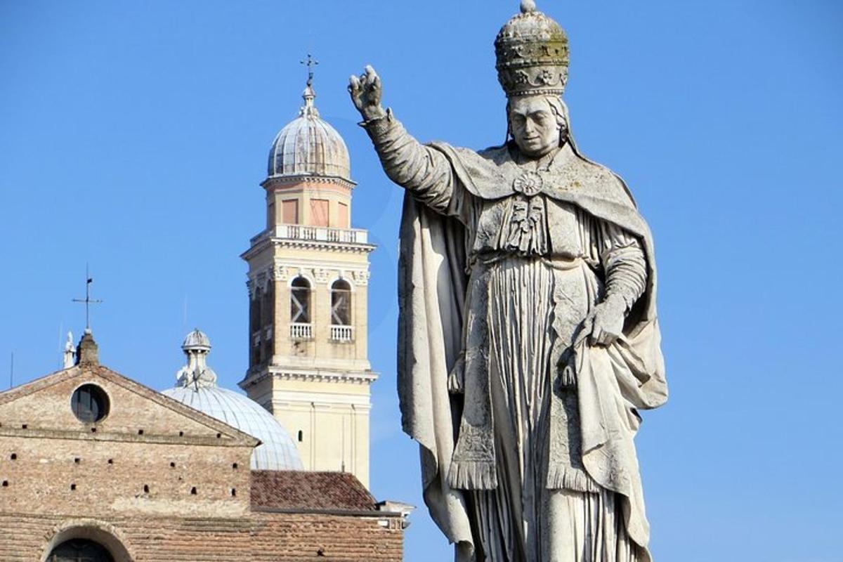 a statue of a king in front of a building