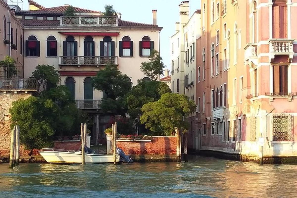 a boat in a canal in front of buildings
