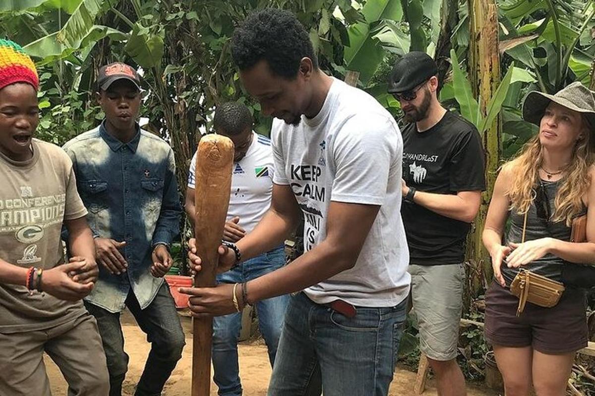 a man holding a baseball bat next to a group of people