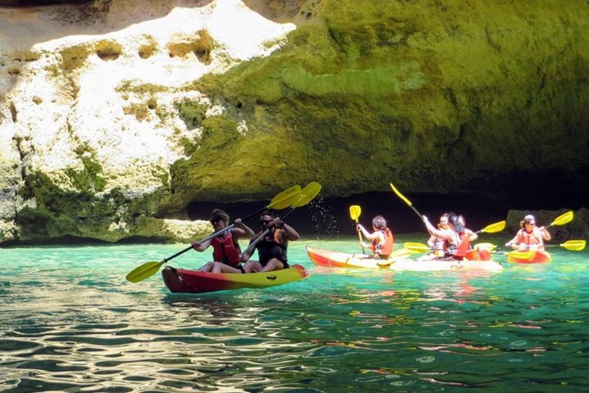 a group of people in kayaks in the water