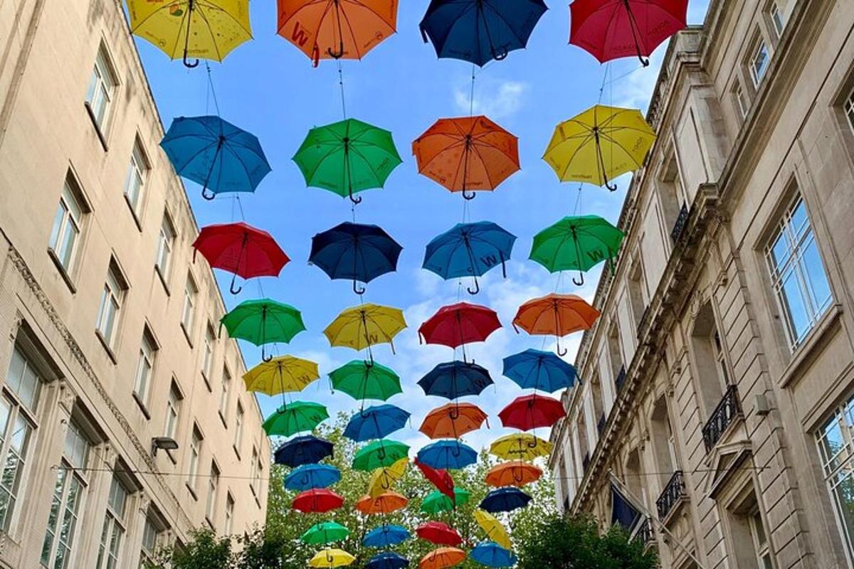 a bunch of umbrellas in the sky