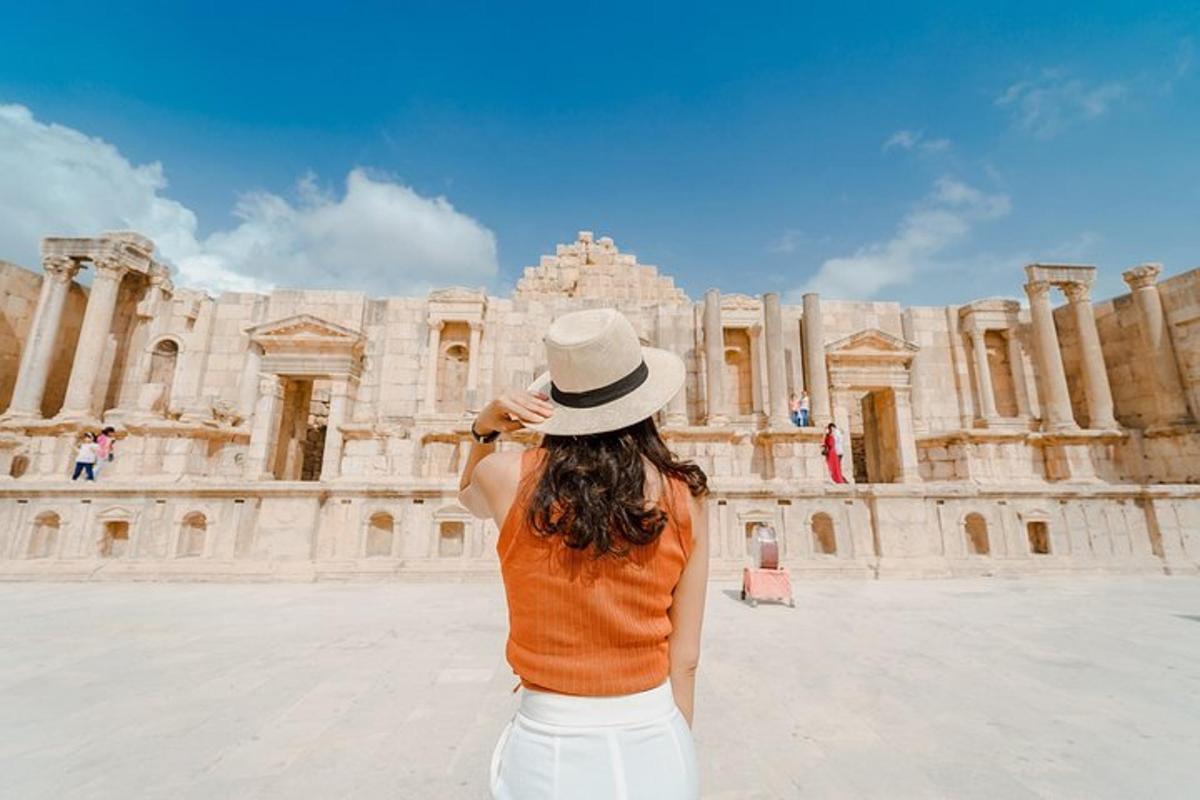 a woman taking a picture of a building