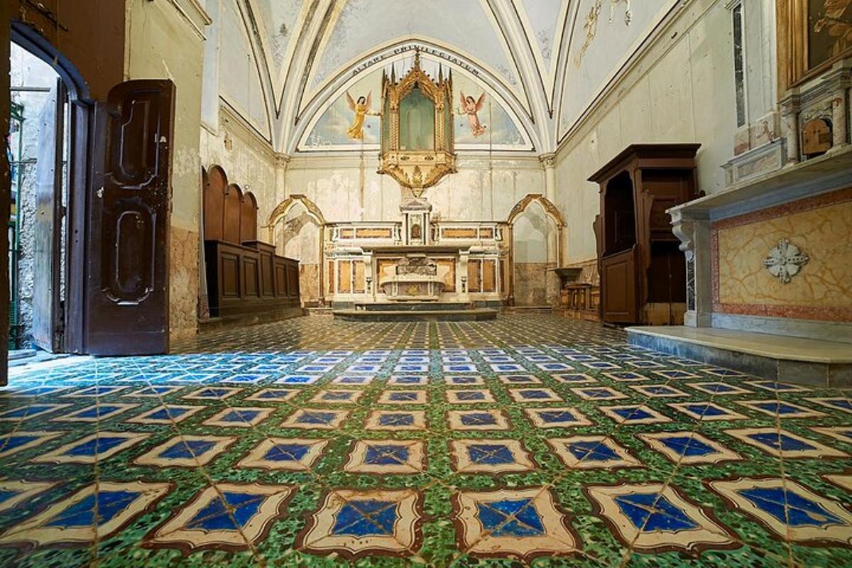 an empty room with a tiled floor in a building