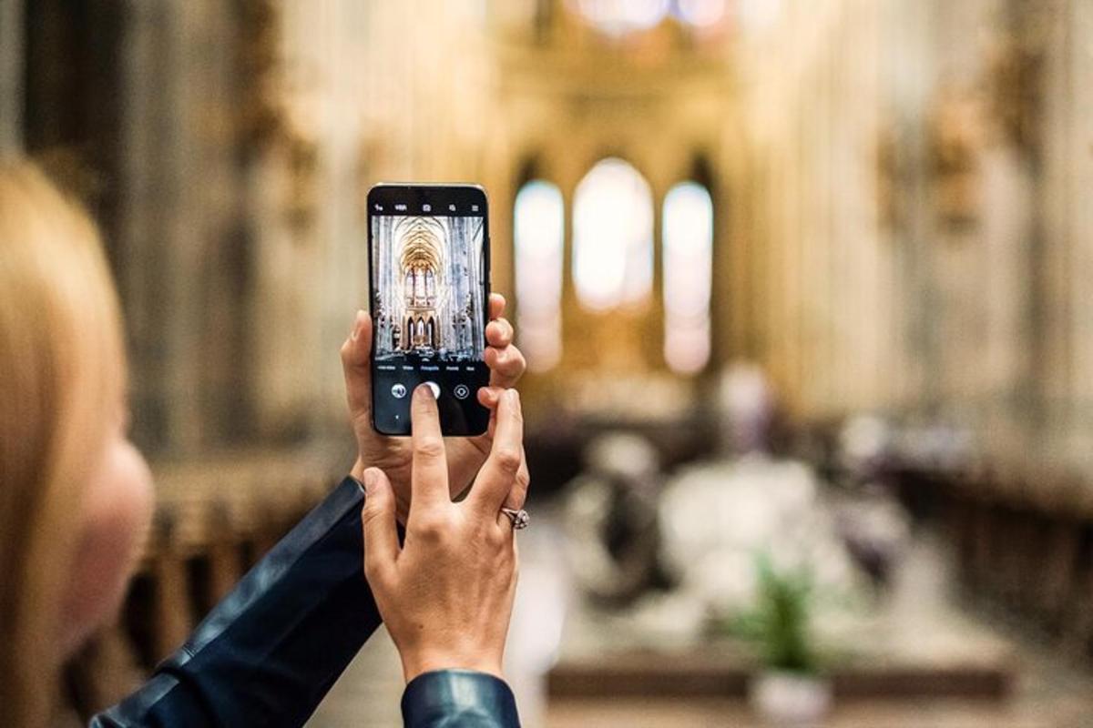 a person taking a picture with a cell phone