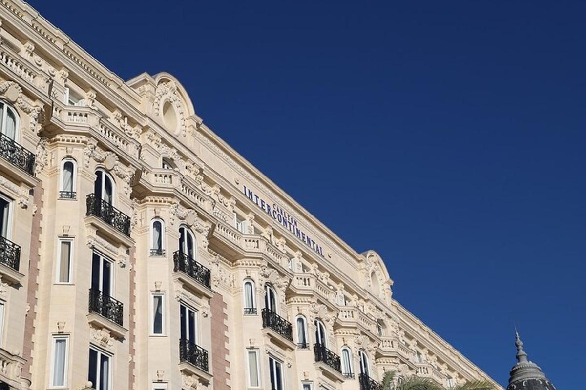 a large white building with a blue sky in the background