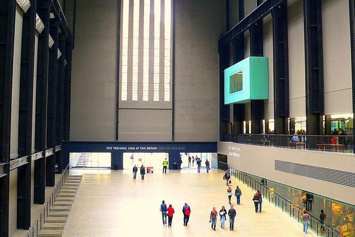 a group of people walking through a large building