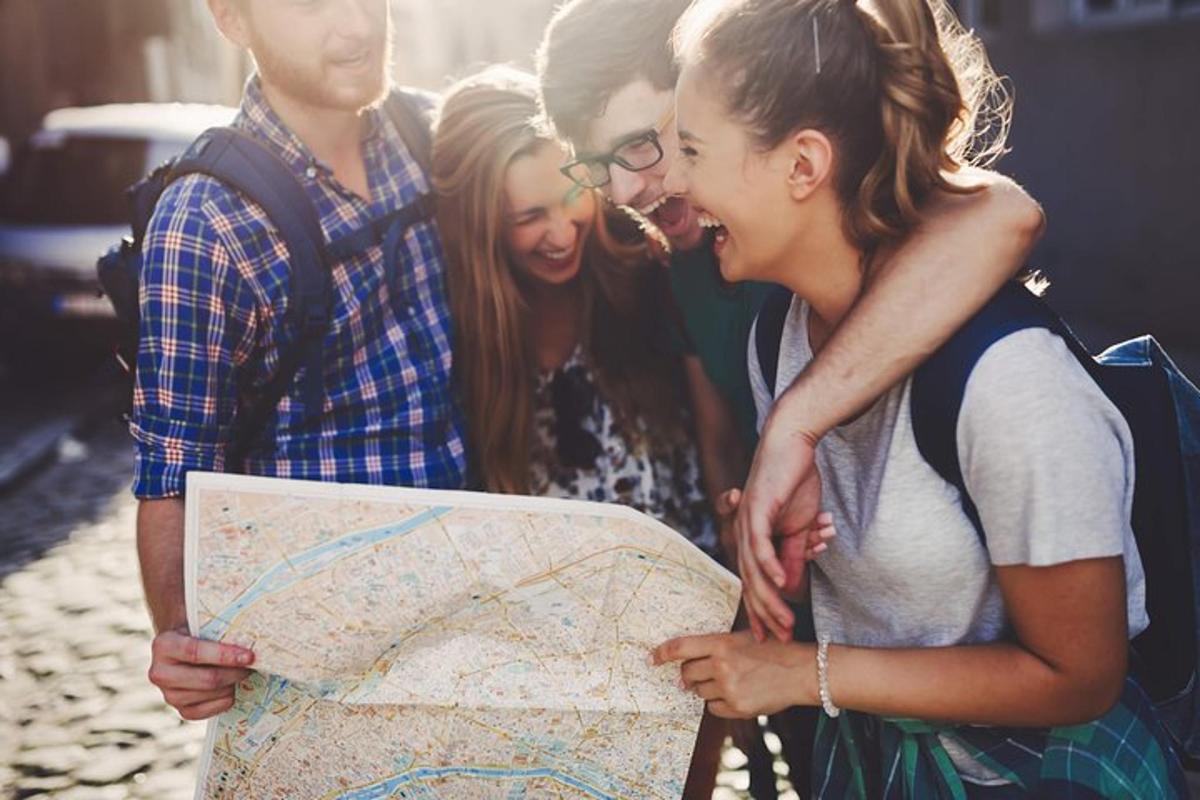 a group of young people looking at a map