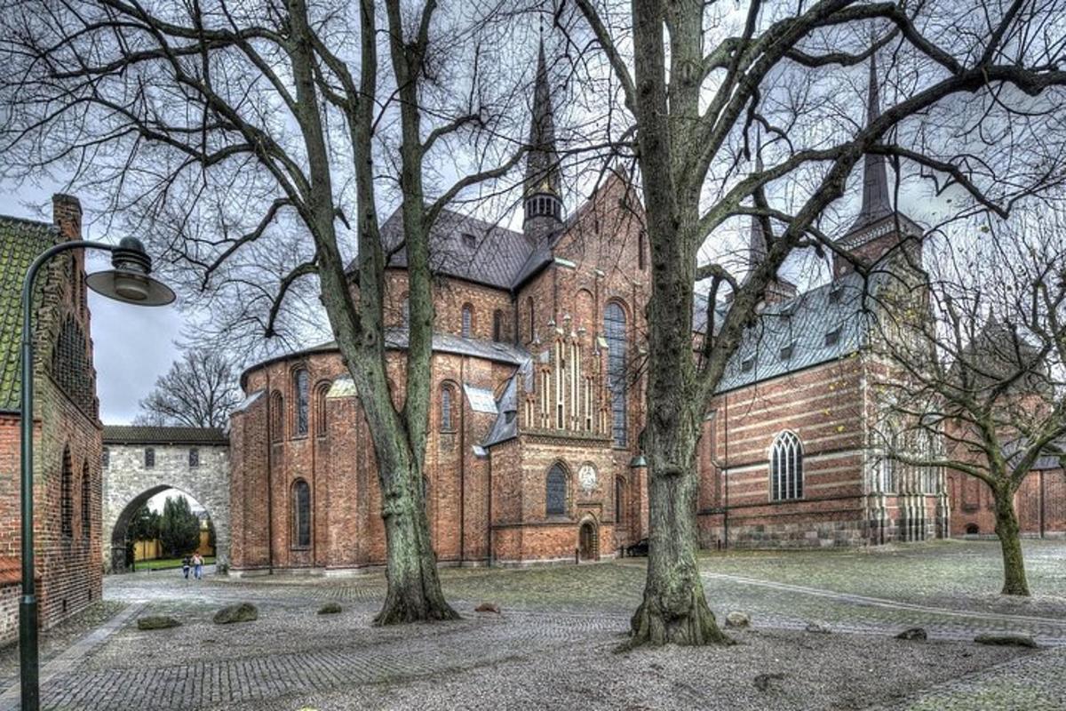 a large brick building with trees in front of it