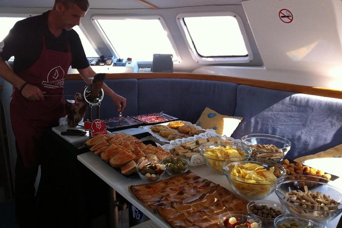 a man standing next to a table full of food