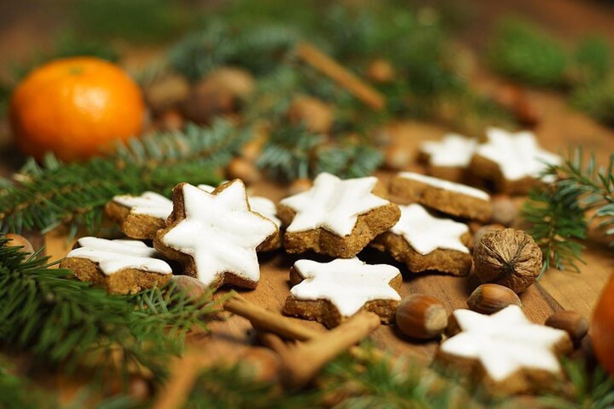 a group of gingerbread cookies on a table with christmas trees
