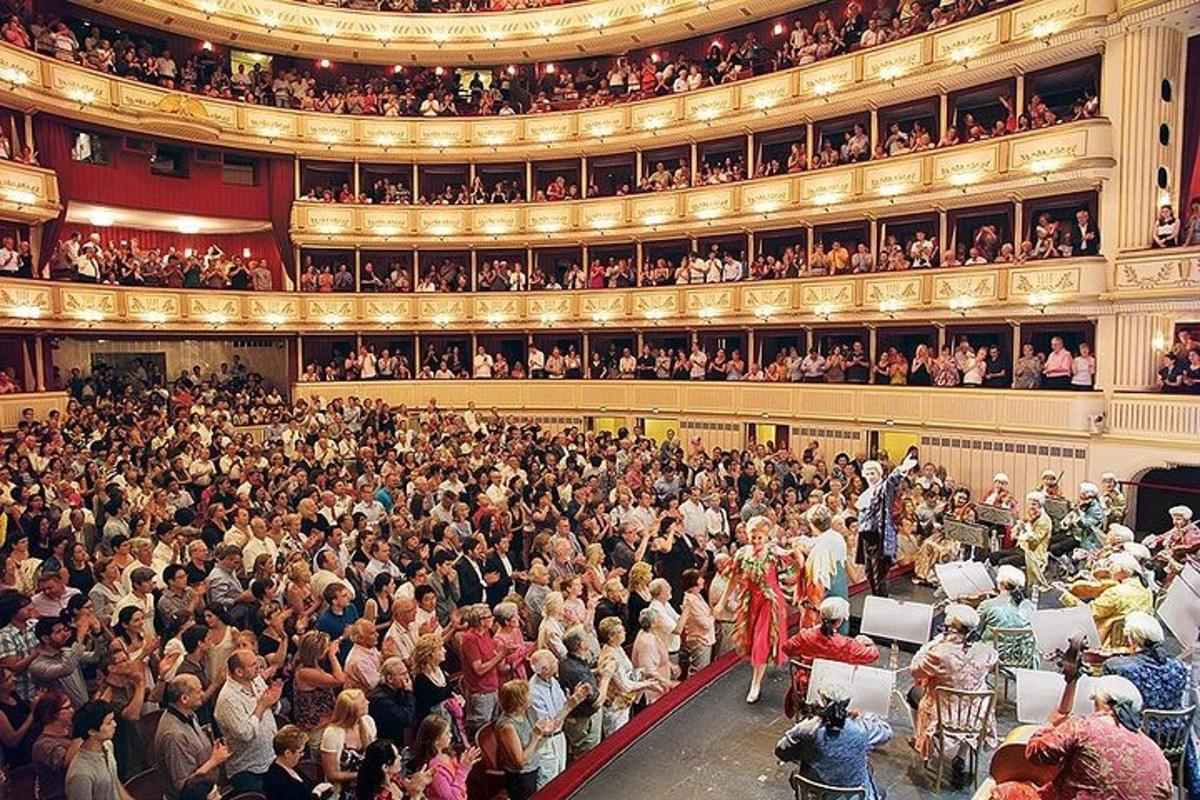 a large crowd of people in a large auditorium