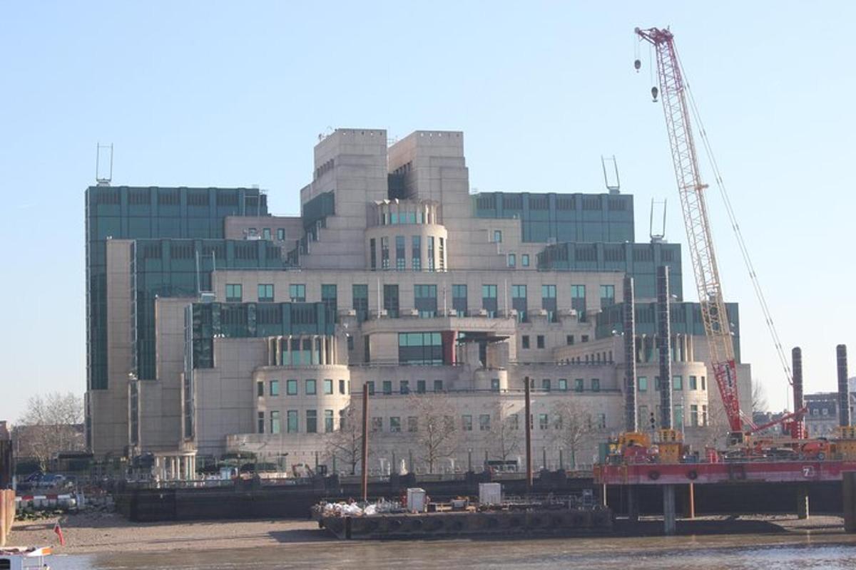 a large building with a crane in front of it
