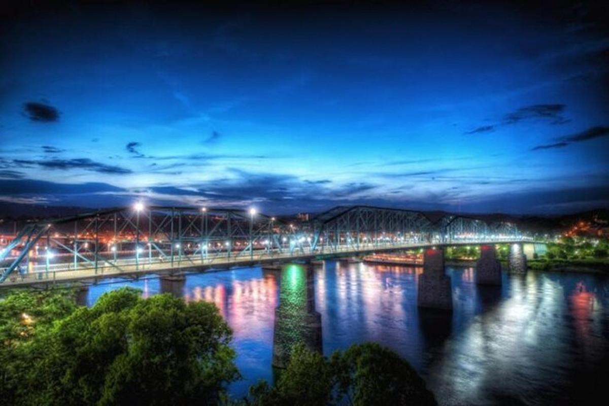 a bridge over a river at night