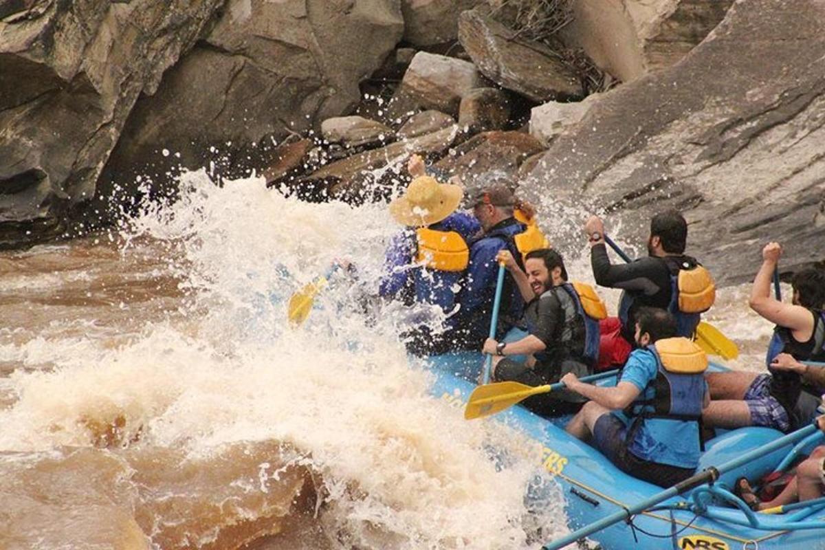 a group of people on a raft in a river