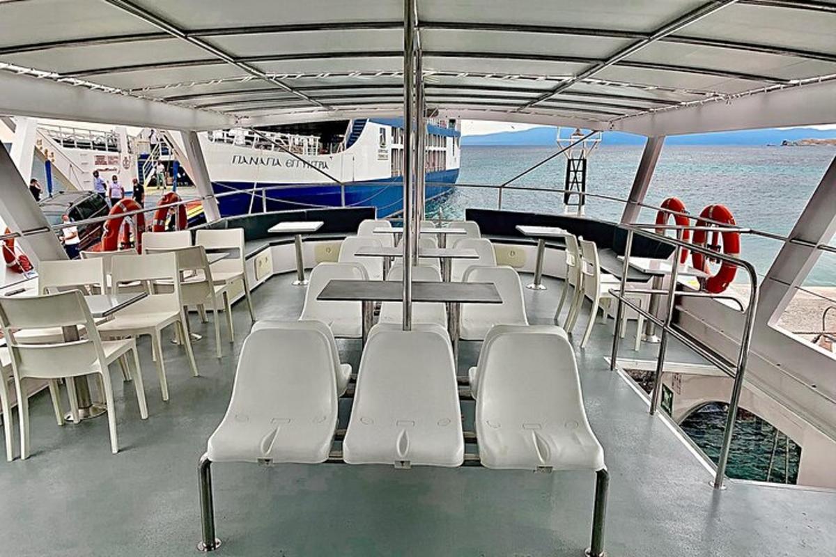 a group of tables and chairs on a boat
