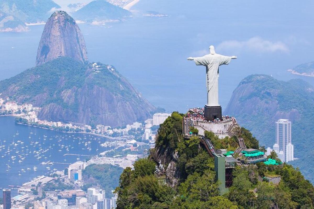 a statue of christ the redeemer on top of a mountain