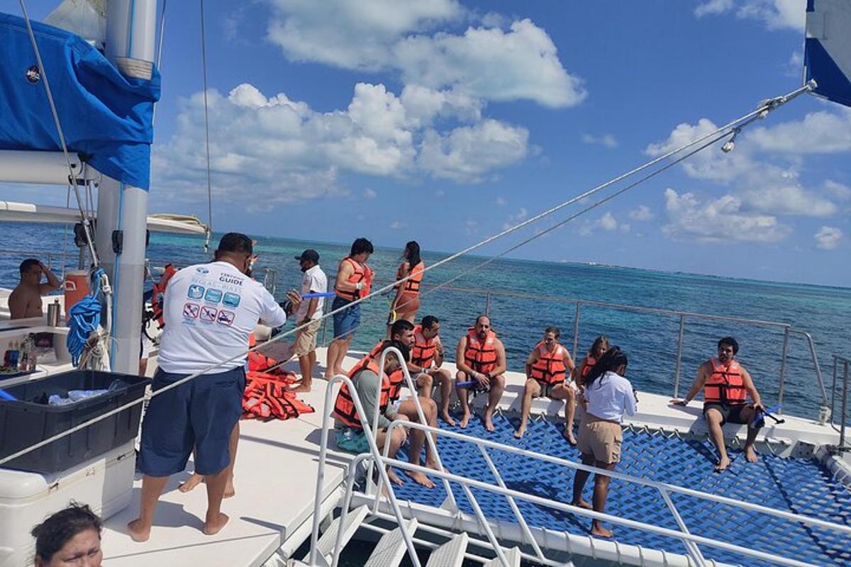 a group of people on a boat in the ocean