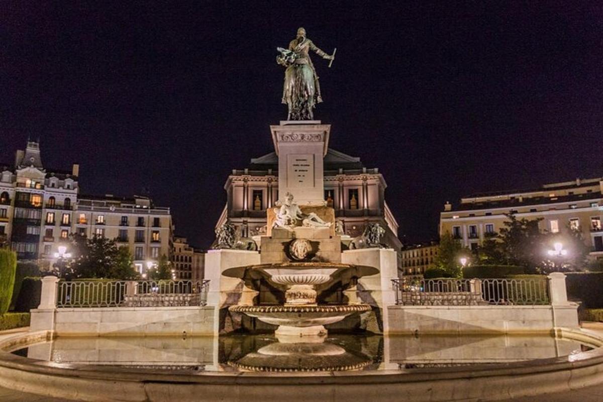 a statue of a woman standing on top of a monument