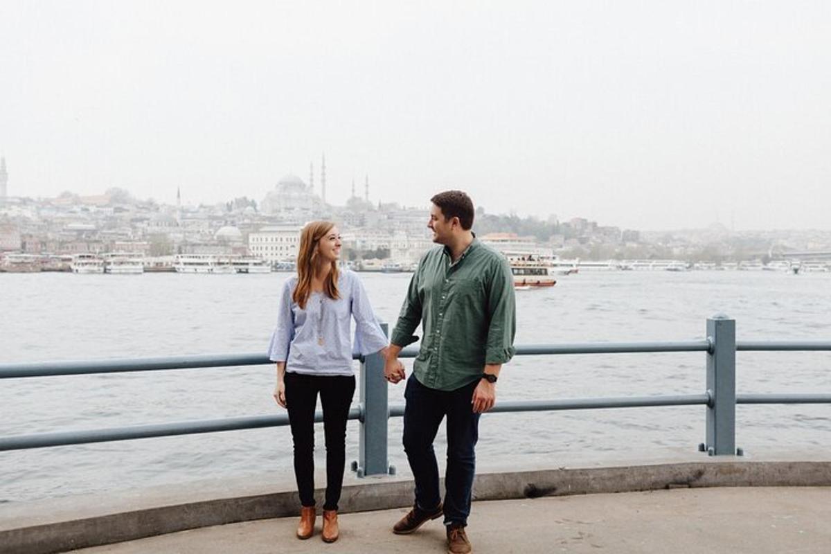 a man and a woman standing next to the water