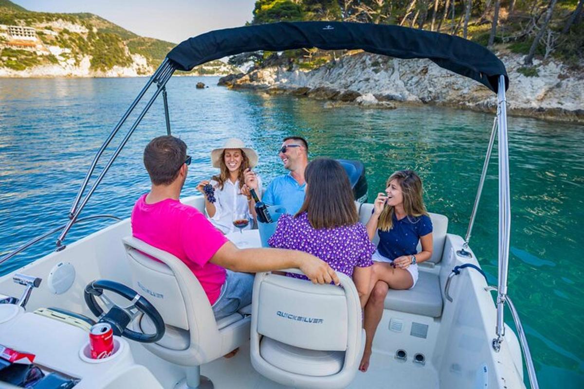 a group of people sitting on a boat in the water