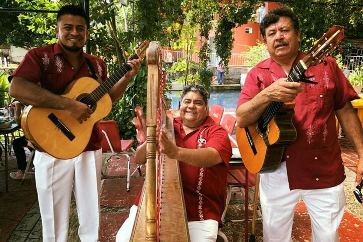 two men playing music and a man playing guitar