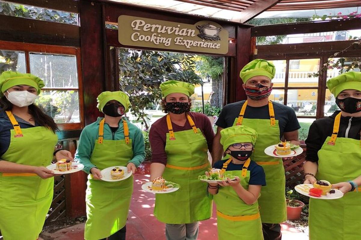a group of people in green aprons holding plates of food
